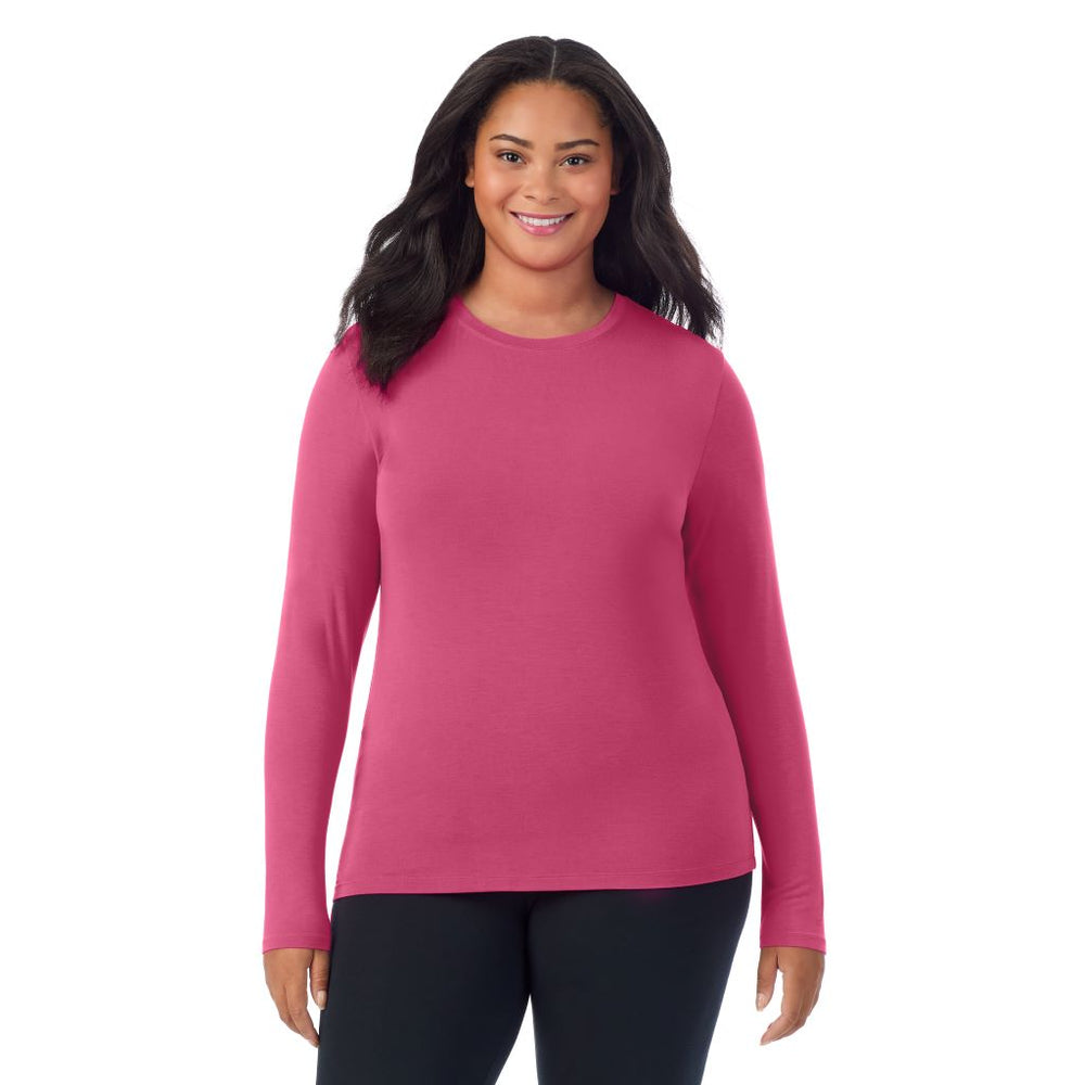 A lady wearing a very berry long sleeve crew plus.