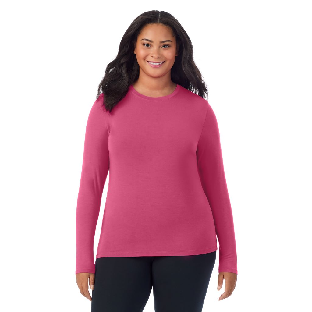 A lady wearing a very berry long sleeve crew plus.