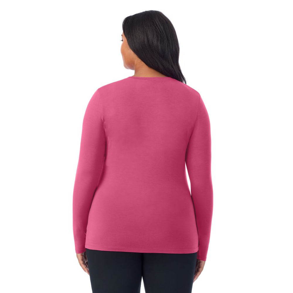 A lady wearing a very berry long sleeve crew plus.