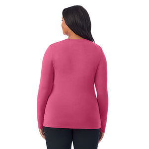 A lady wearing a very berry long sleeve crew plus.