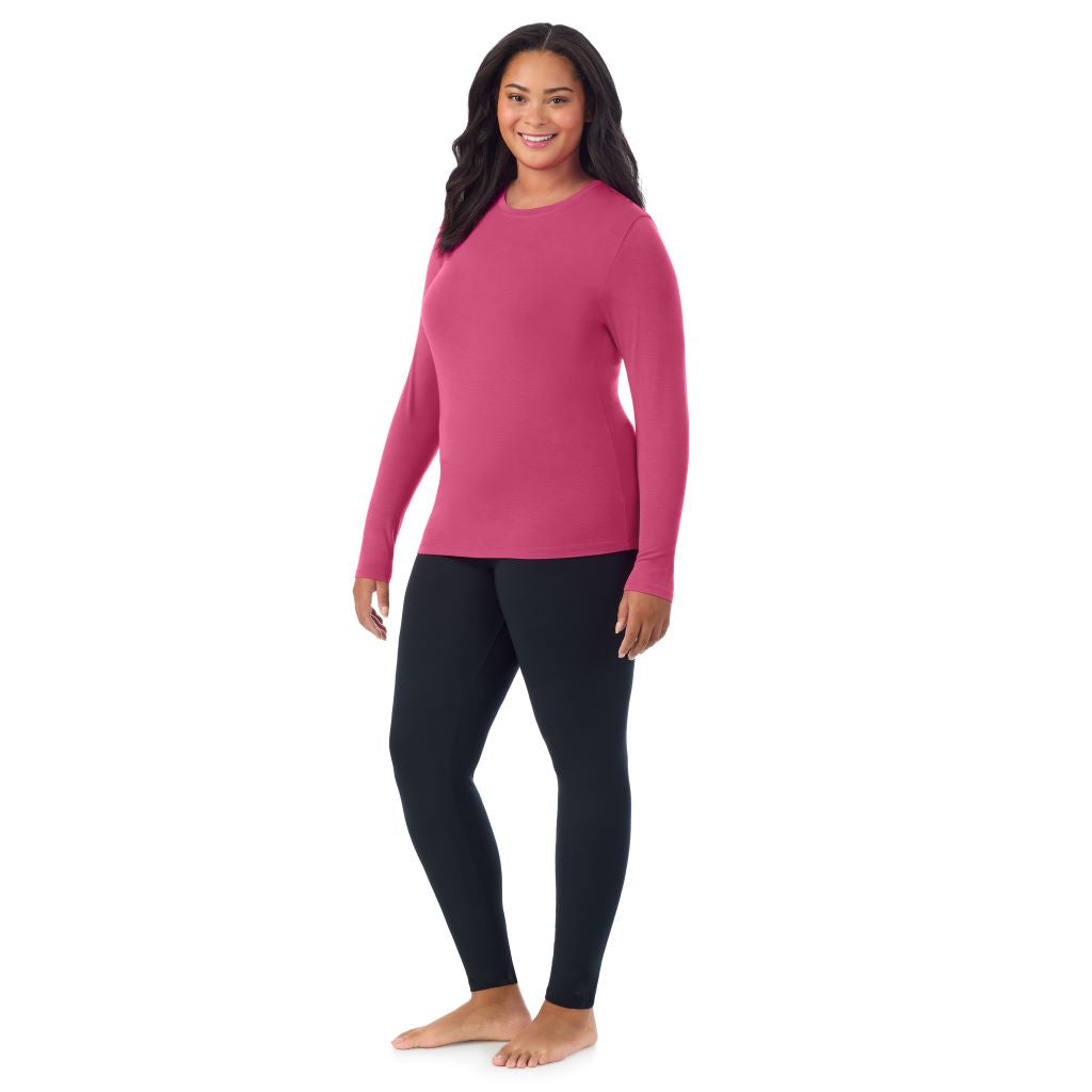A lady wearing a very berry long sleeve crew plus.