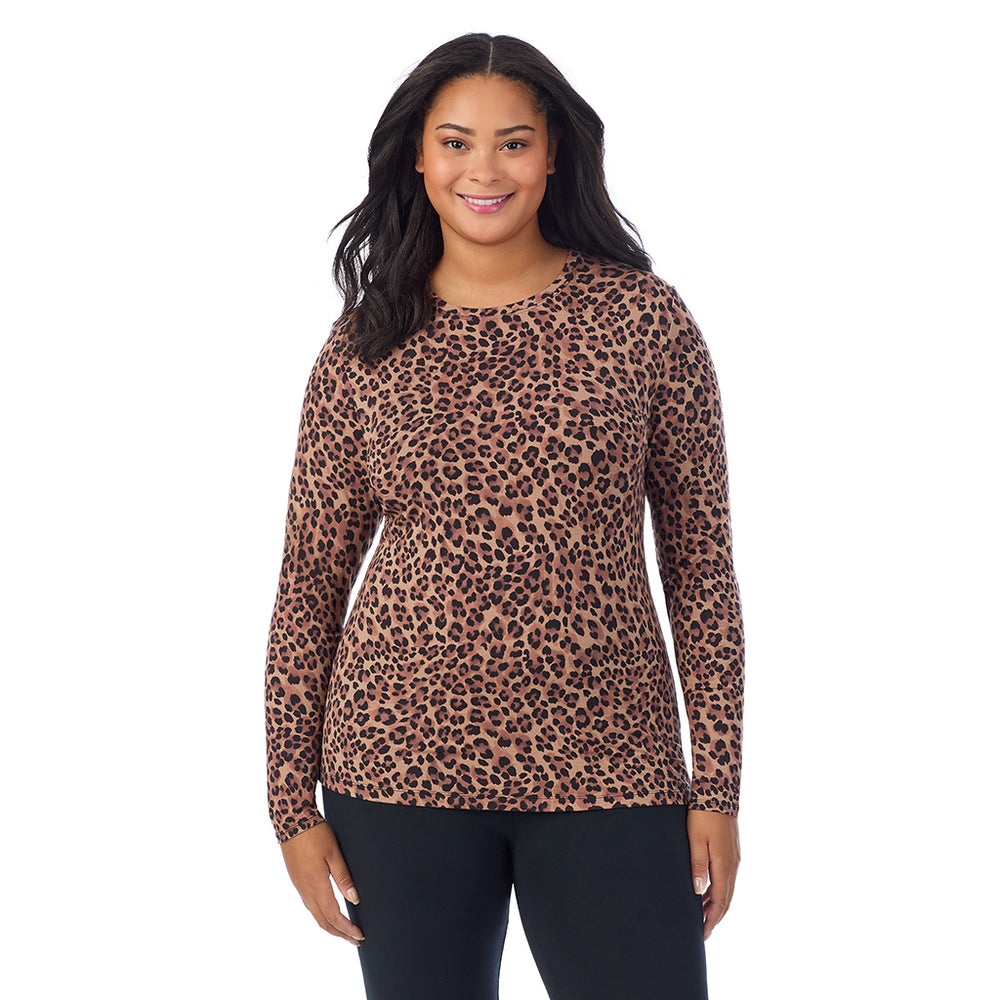 A lady wearing a taupe leopard long sleeve crew plus.