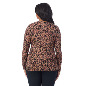 A lady wearing a taupe leopard long sleeve crew plus.