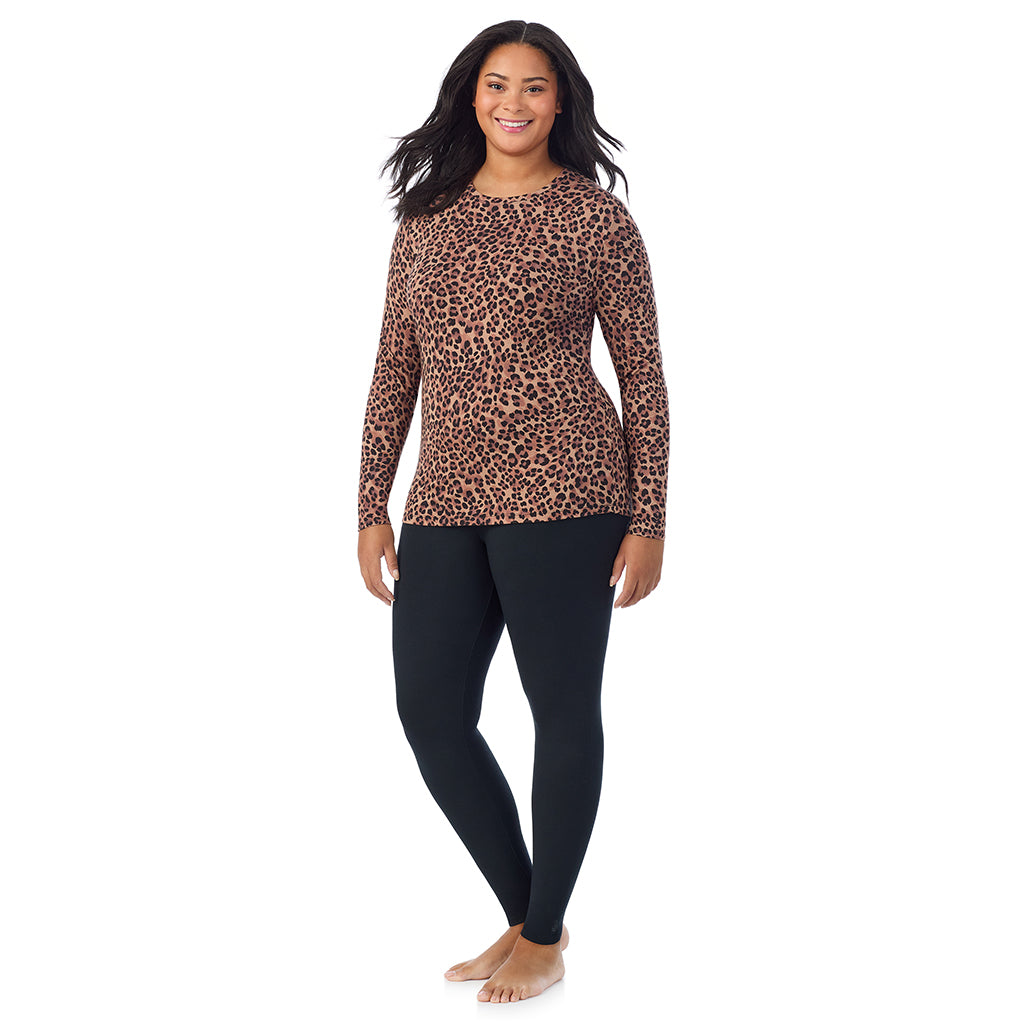 A lady wearing a taupe leopard long sleeve crew plus.