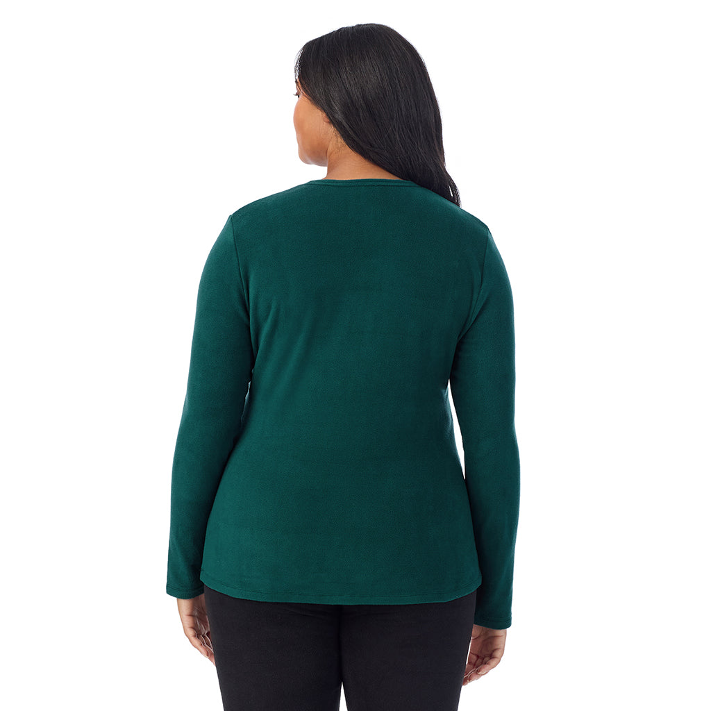 A lady wearing Dark Pine fleecewear with stretch long sleeve crew plus.