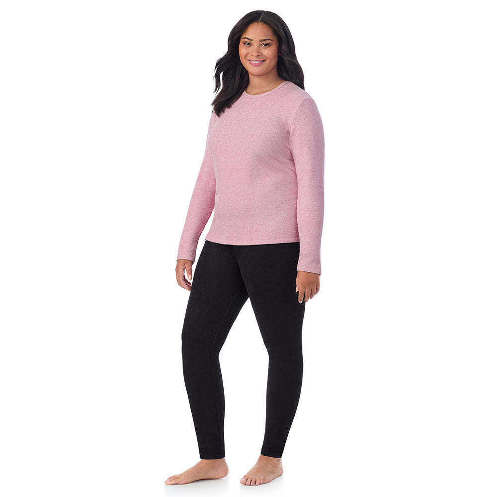 A lady wearing Mauve Mist Heather fleecewear with stretch long sleeve crew plus.