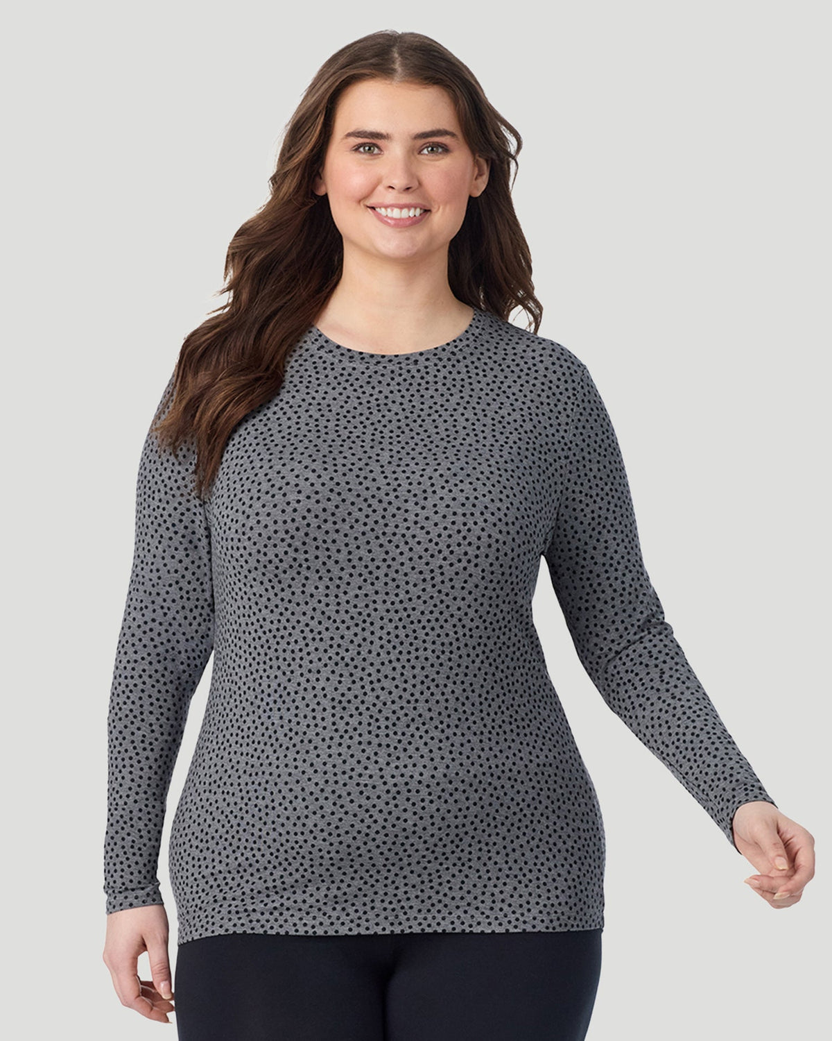 Charcoal Polka Dot ; Model is wearing size 1X. She is 5'10", Bust 44", Waist 36", Hips 49". @ A Plus size lady wearing Charcoal Polka Dot Softwear With Stretch Long Sleeve Crew PLUS in a front view pose