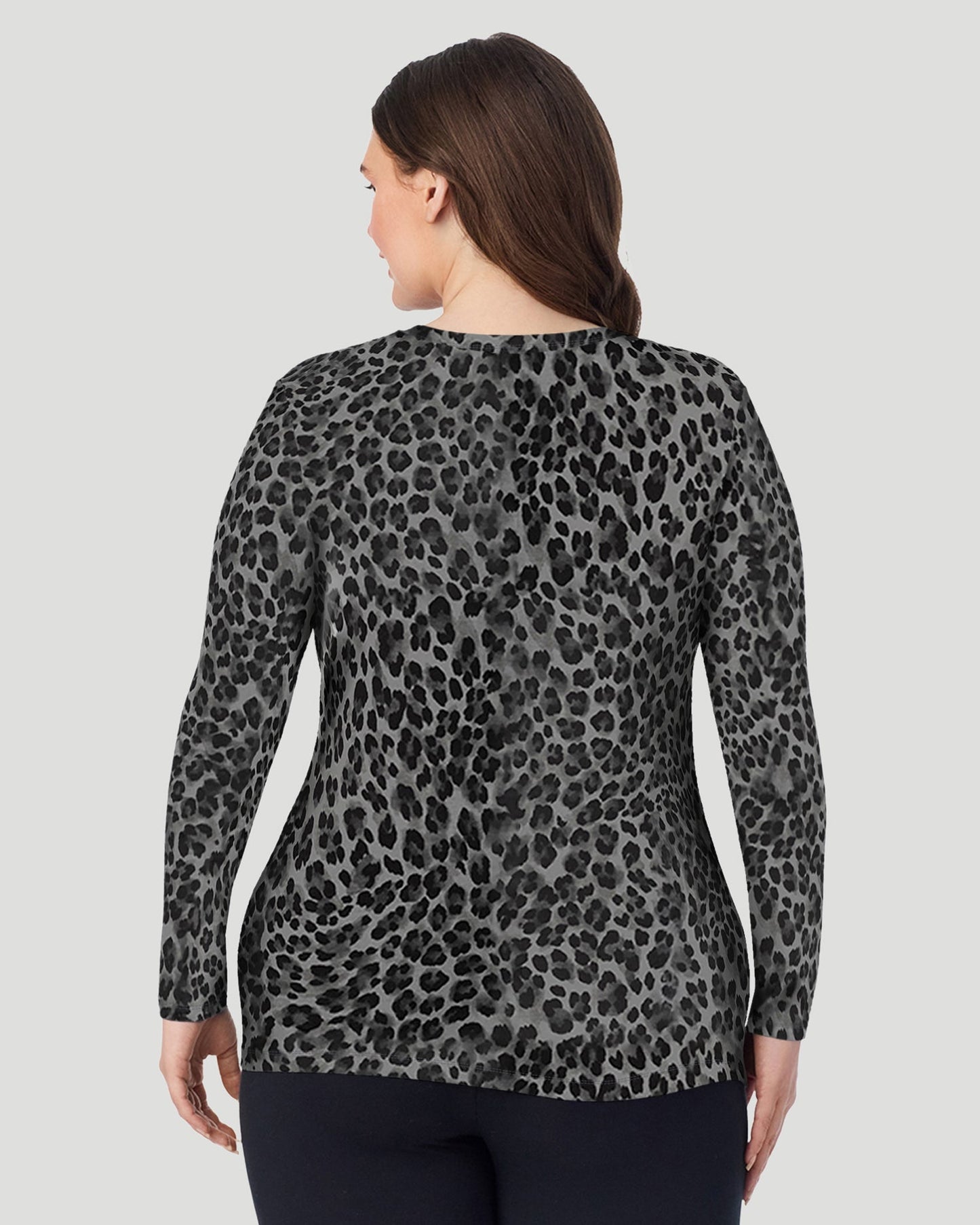 Charcoal Leopard; Model is wearing size 1X. She is 5'10", Bust 44", Waist 36", Hips 49". @ A Plus size lady wearing Charcoal Leopard Softwear With Stretch Long Sleeve Crew PLUS in a back view pose