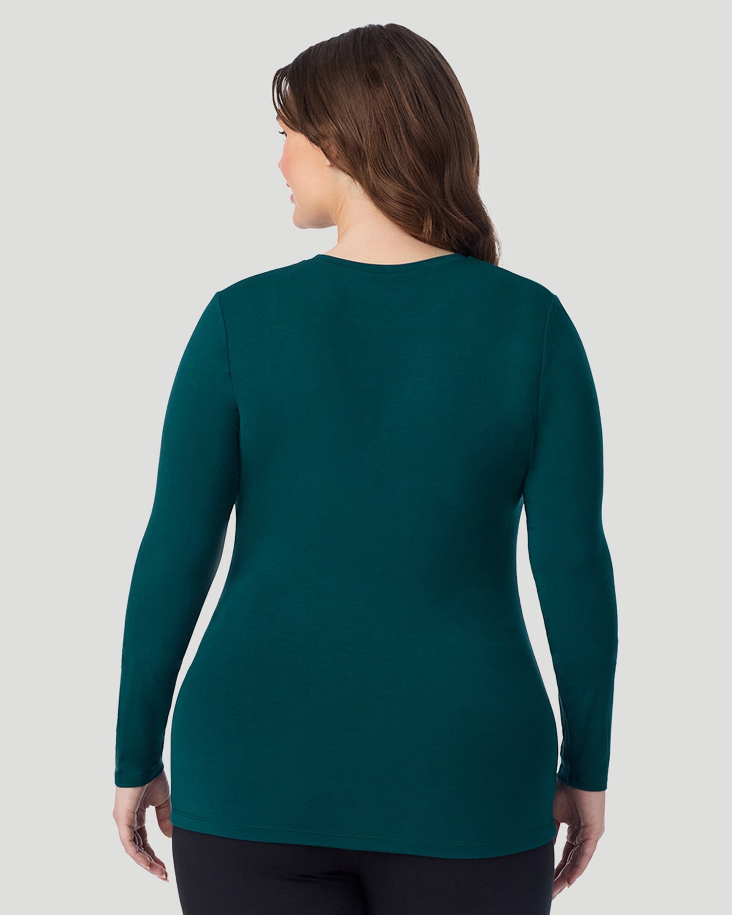  A Plus size lady wearing Deep Emerald Softwear With Stretch Long Sleeve Crew PLUS in a back view pose