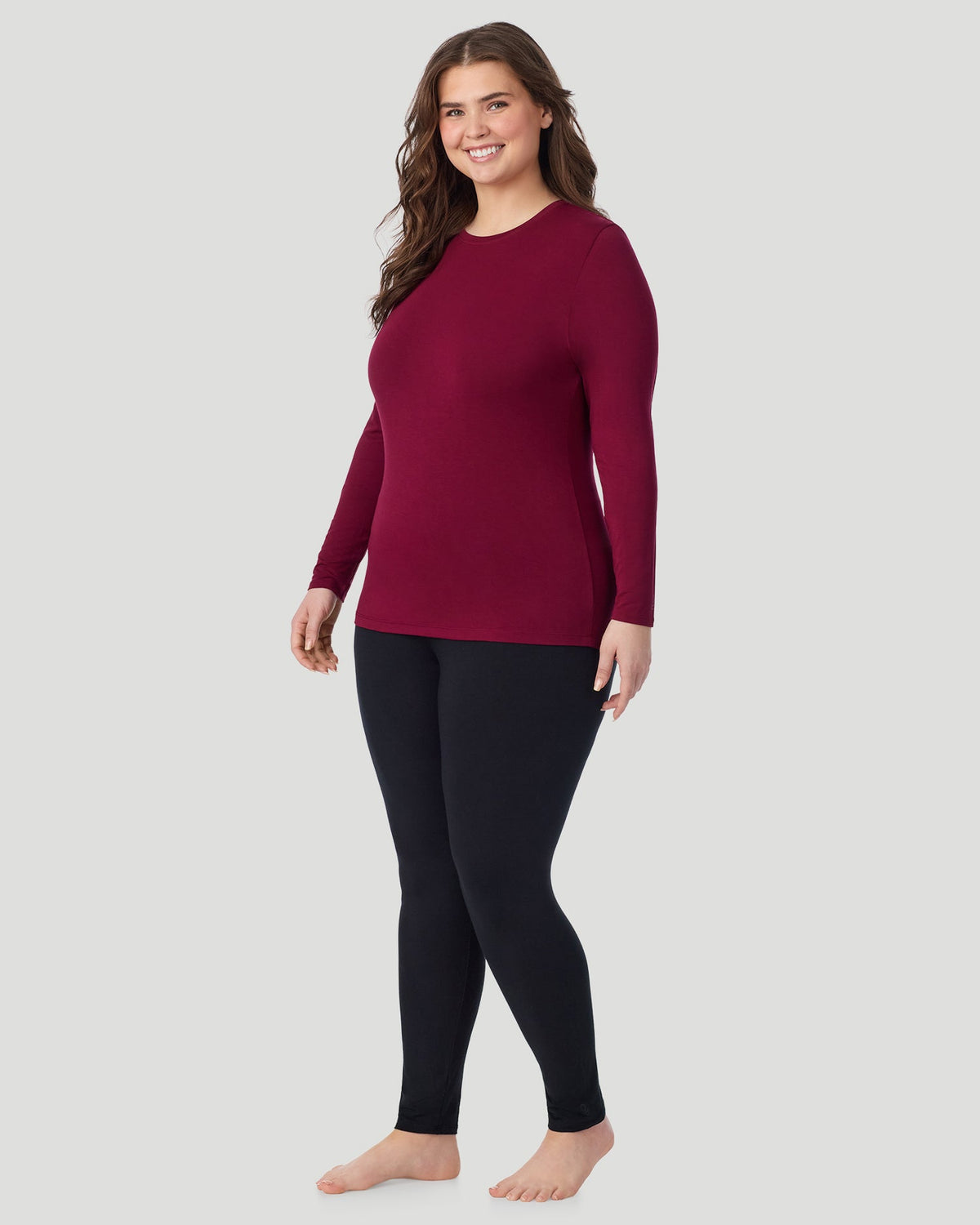 Scarlet; Model is wearing size 1X. She is 5'10", Bust 44", Waist 36", Hips 49". @ A Plus size lady wearing Scarlet Softwear With Stretch Long Sleeve Crew PLUS in a front view standing pose