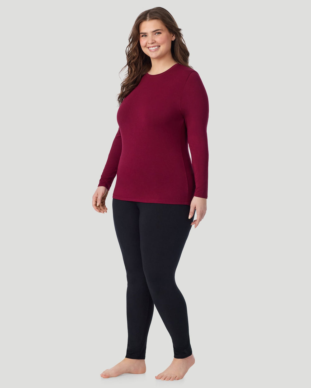 A Plus size lady wearing Scarlet Softwear With Stretch Long Sleeve Crew PLUS in a front view standing pose
