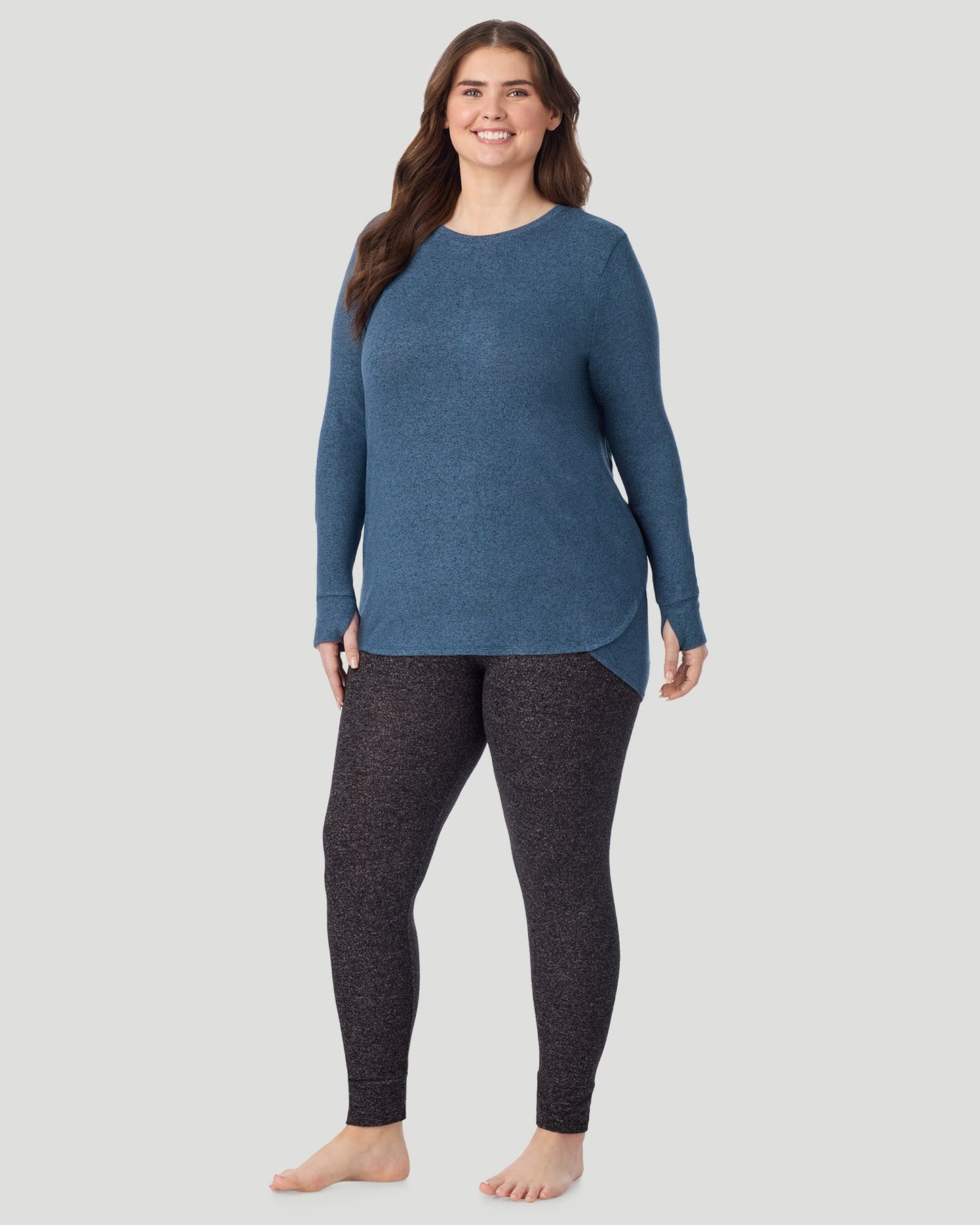 Deep Chambray; Model is wearing size 1X. She is 5'10", Bust 44", Waist 36", Hips 49". @ A Lady is wearing Deep Chambray SoftKnit Long Sleeve Crew PLUS in a front look standing view