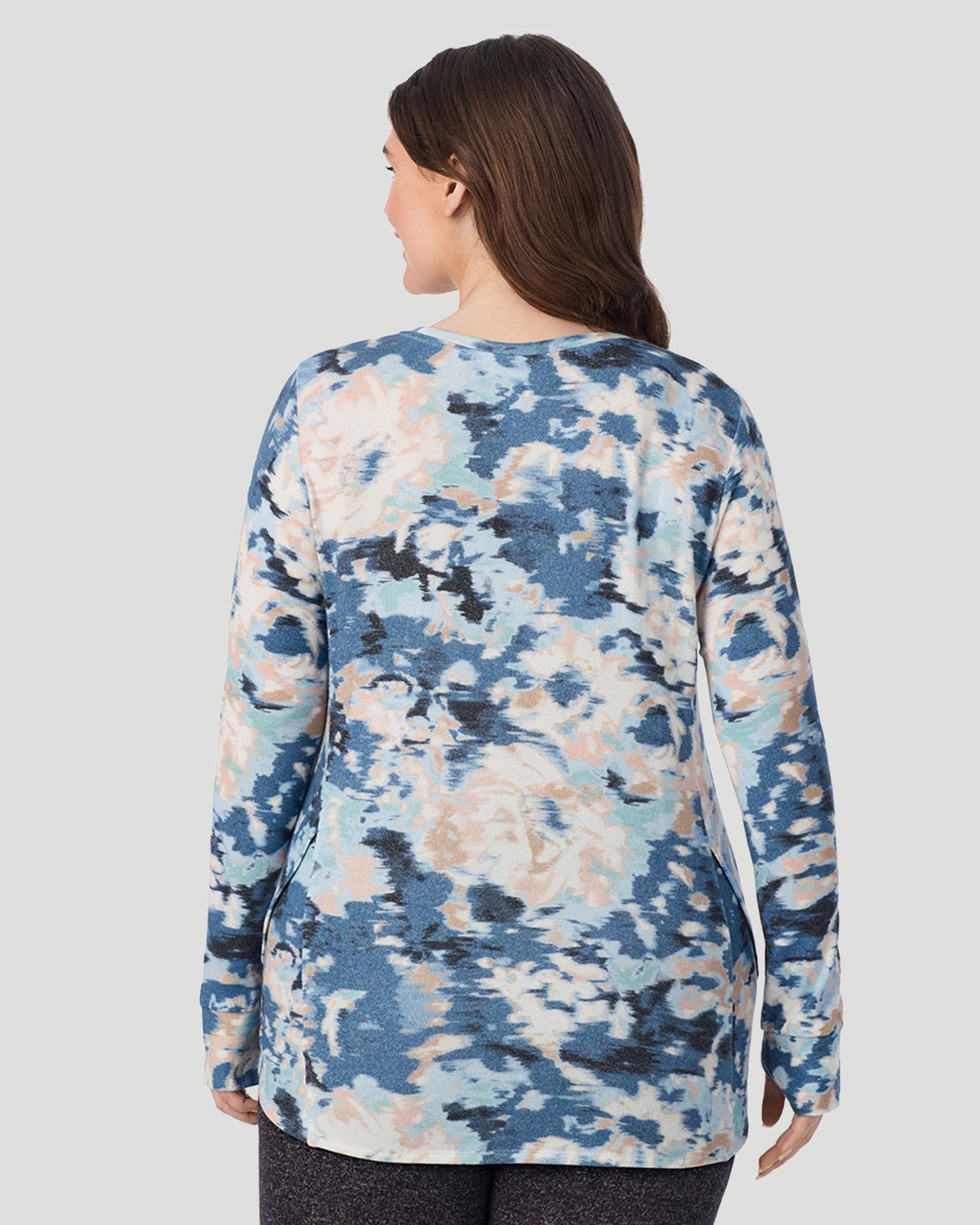 Blue Floral; Model is wearing size 1X. She is 5'10", Bust 44", Waist 36", Hips 49". @ A Lady is wearing Blue Floral SoftKnit Long Sleeve Crew PLUS in a back look closer view