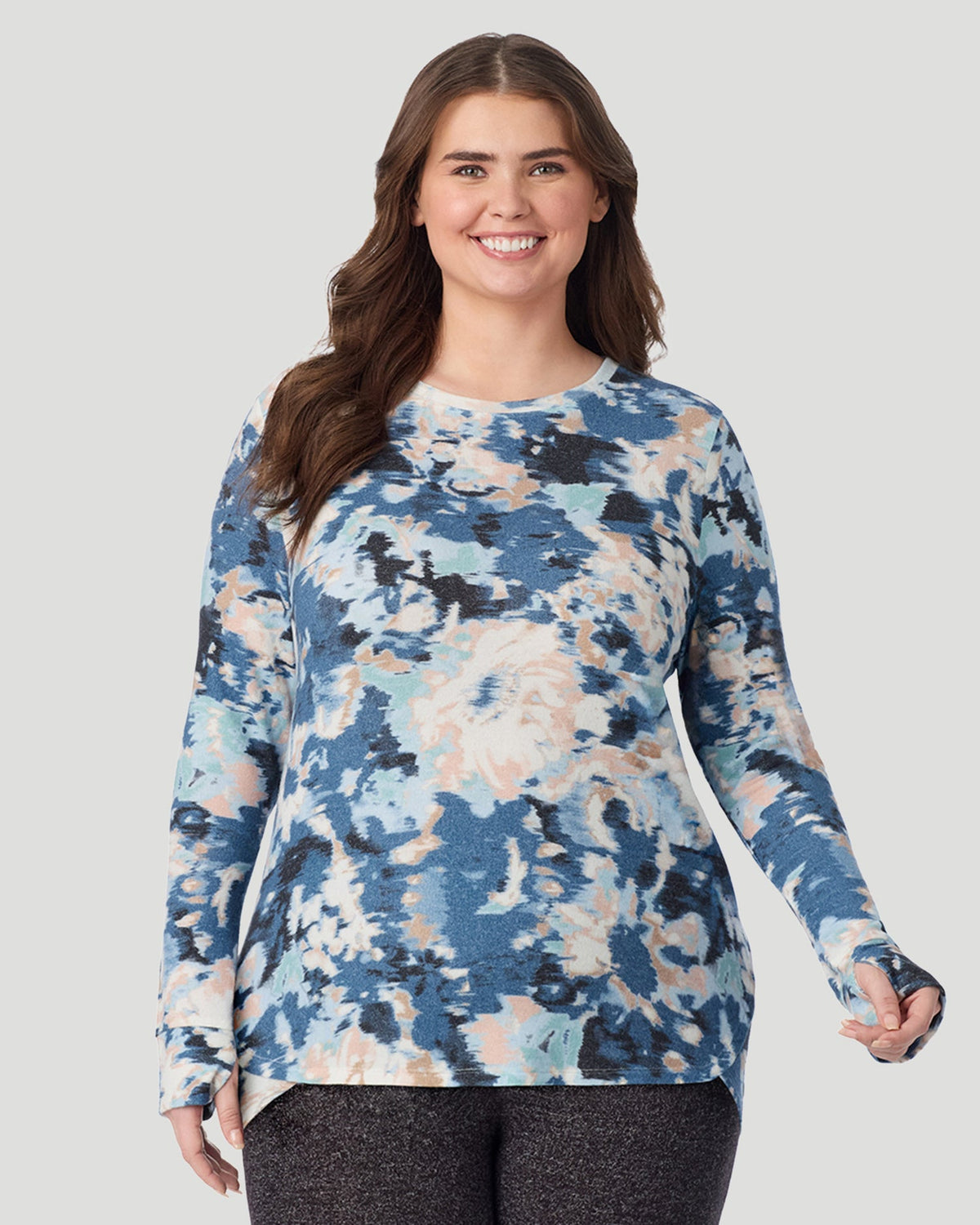 Blue Floral; Model is wearing size 1X. She is 5'10", Bust 44", Waist 36", Hips 49". @ A Lady is wearing Blue Floral SoftKnit Long Sleeve Crew PLUS in a front look closer view