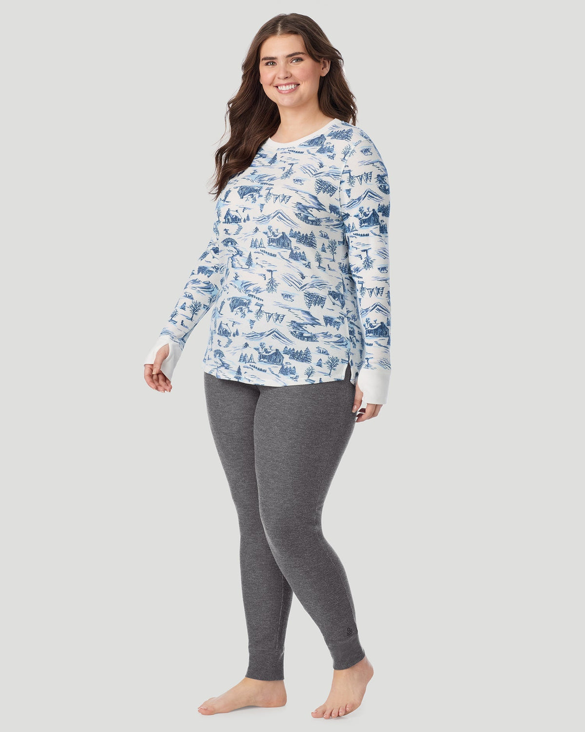 A lady wearing Cozy Stretch Thermal Long Sleeve Crew PLUS in Blue Winter Toile