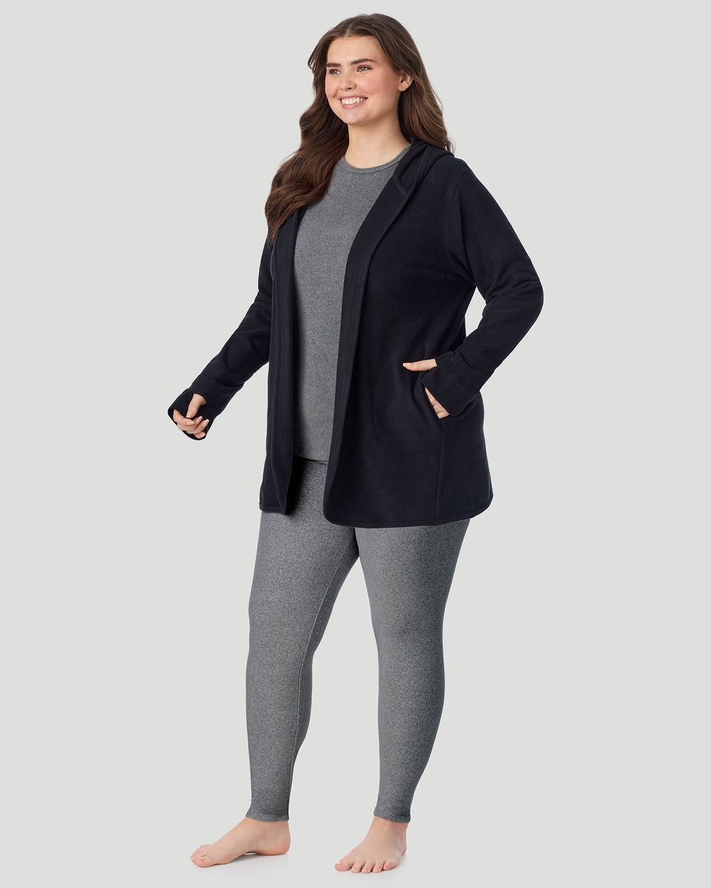 A plus size lady wearing Black Fleecewear with Stretch Wrap With Hood PLUS in a front view standing pose