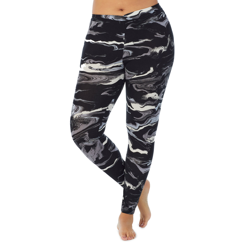 A lady wearing a Black & White Marble stretch legging plus.