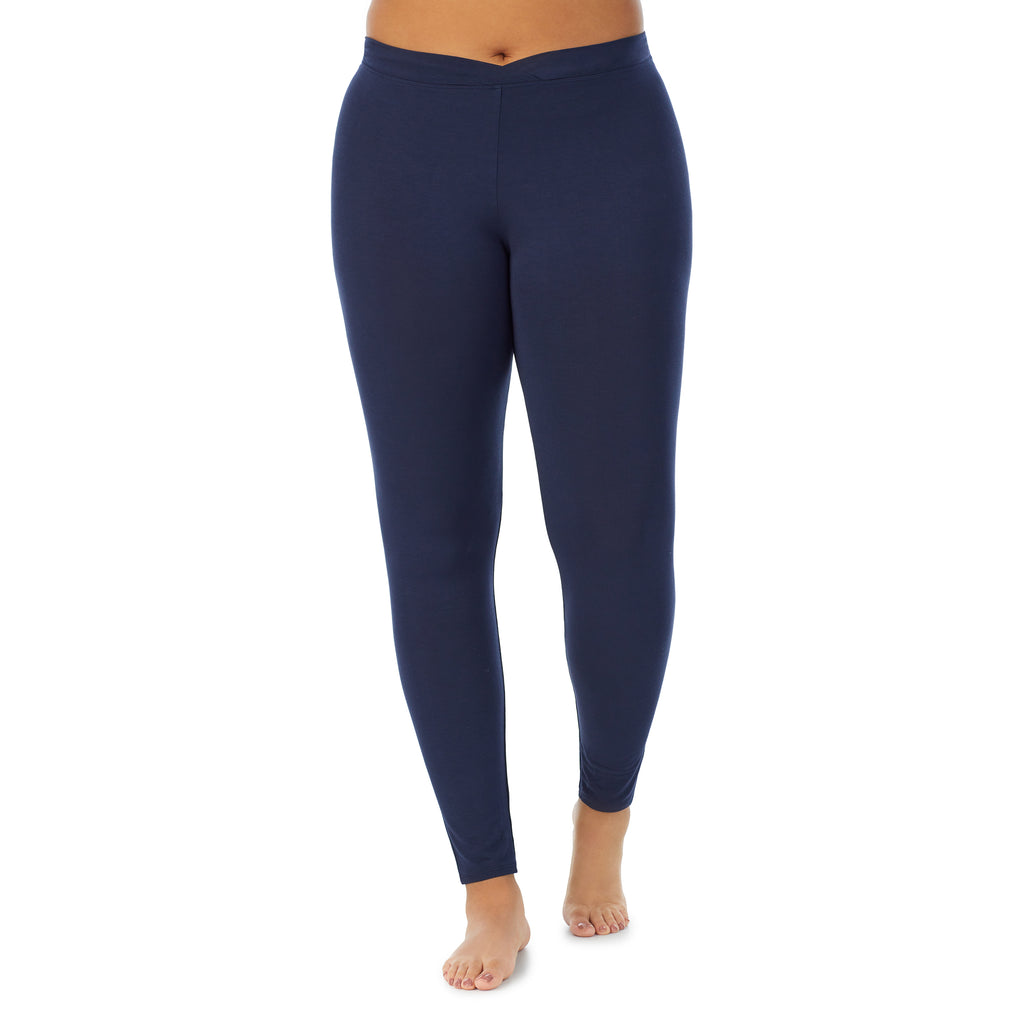 A lady wearing a Navy Blazer stretch legging plus.