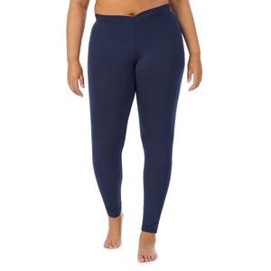 A lady wearing a Navy Blazer stretch legging plus.
