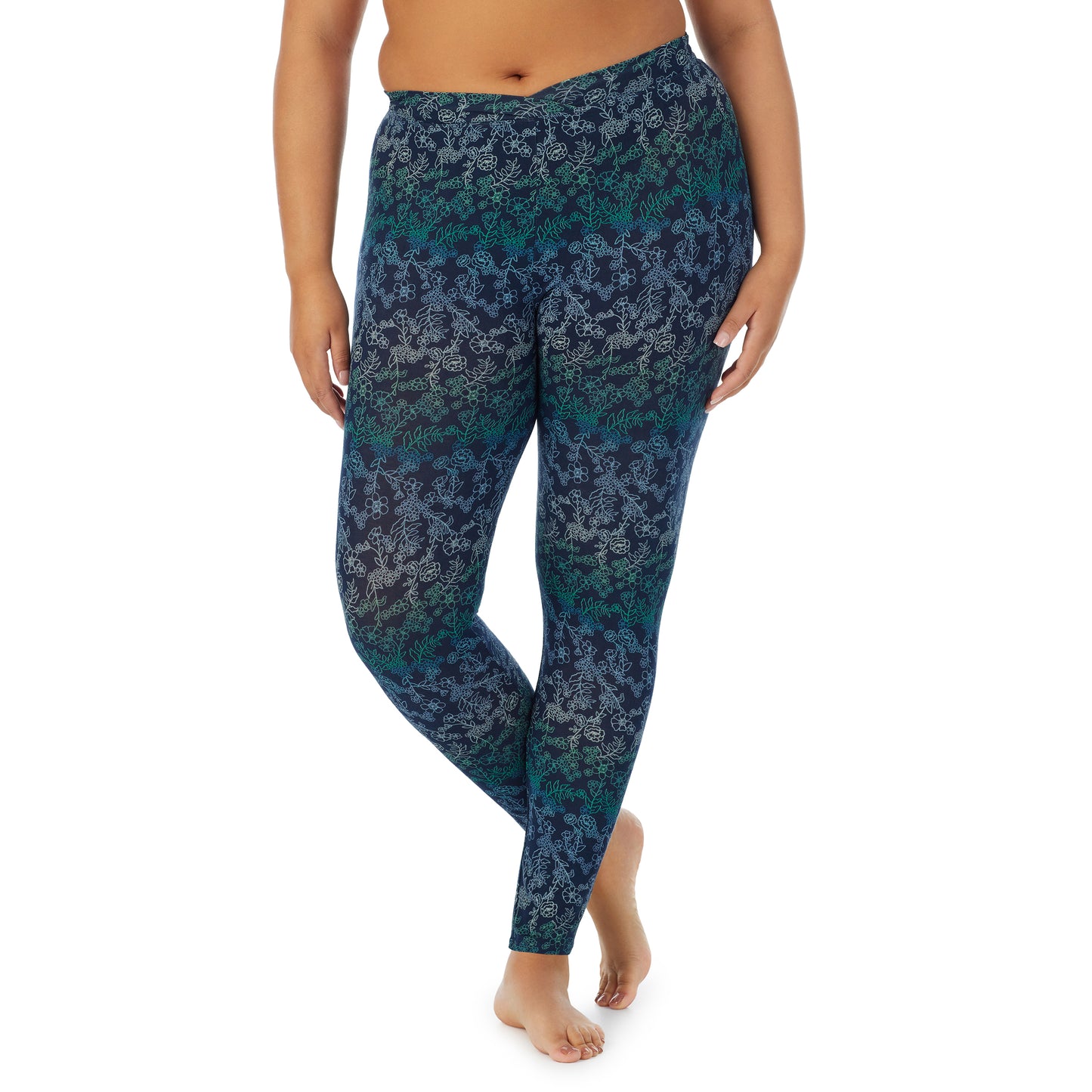 Blue Floral; Model is wearing size 1X. She is 5'11", Bust 36", Waist 36.5", Hips 47.5". @A lady wearing a Blue Floral stretch legging plus.