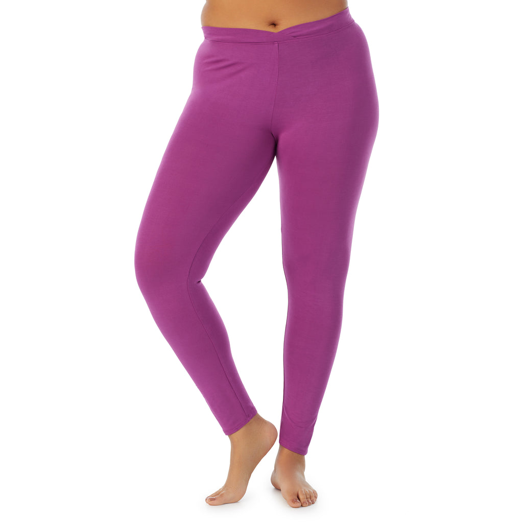 A lady wearing a Purple Radiance stretch legging plus.