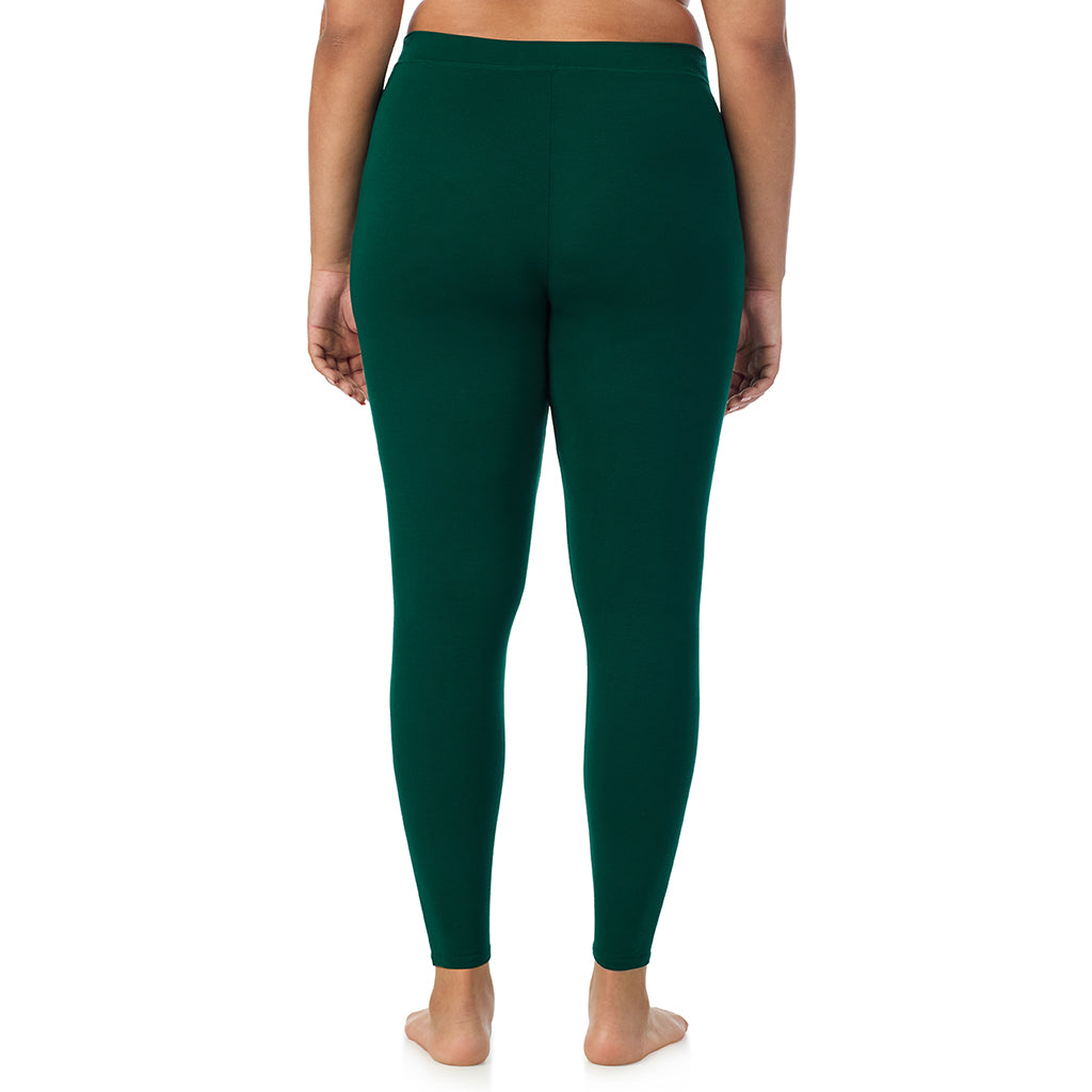 A lady wearing a evergreen stretch legging plus.