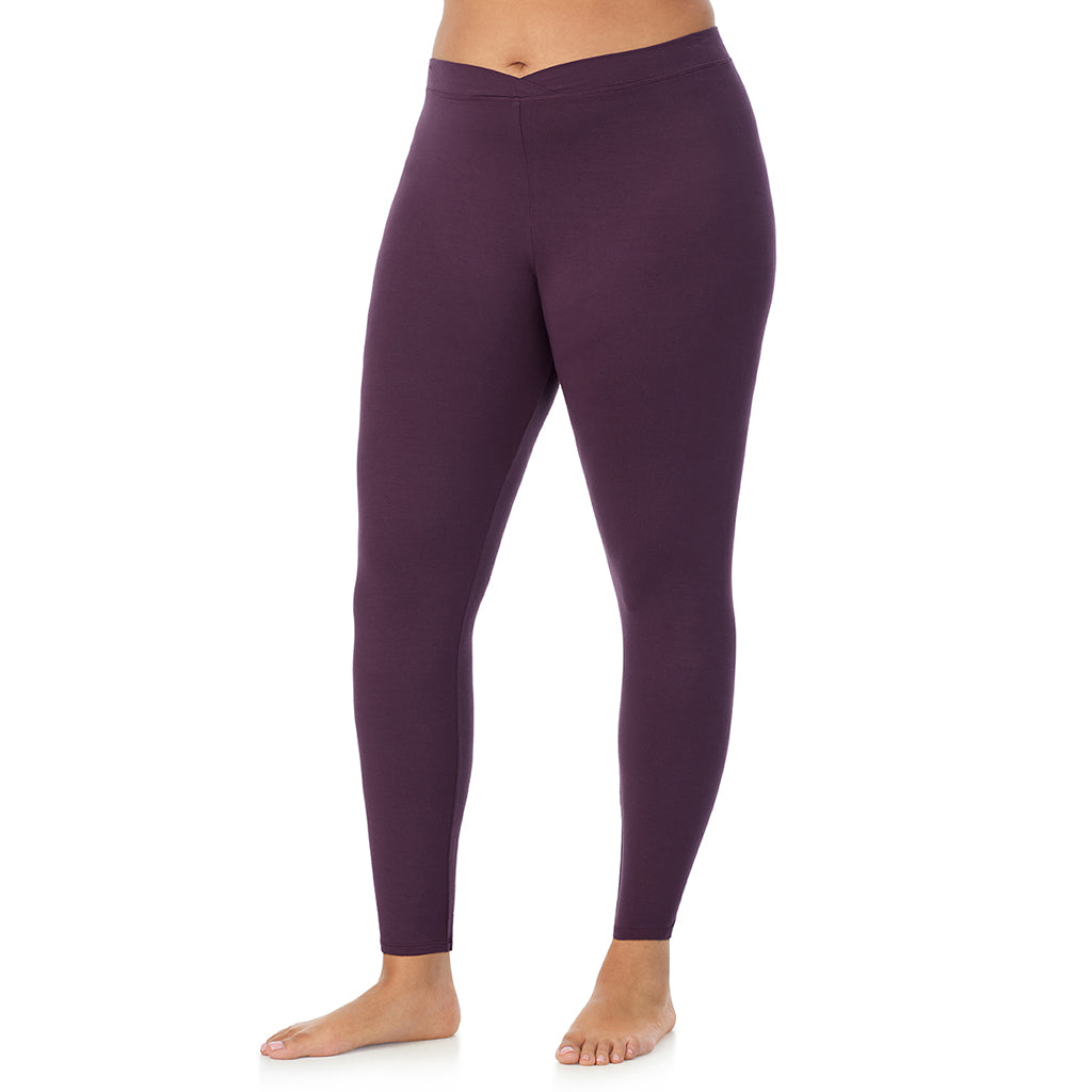 A lady wearing a boysenberry stretch legging plus.