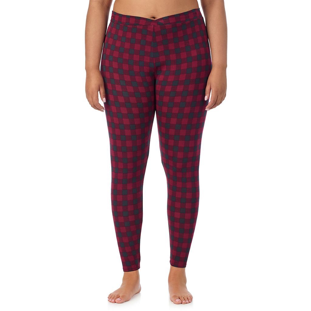 A lady wearing a cabernet buffalo check stretch legging plus.