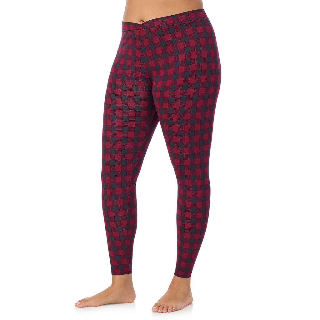 A lady wearing a cabernet buffalo check stretch legging plus.