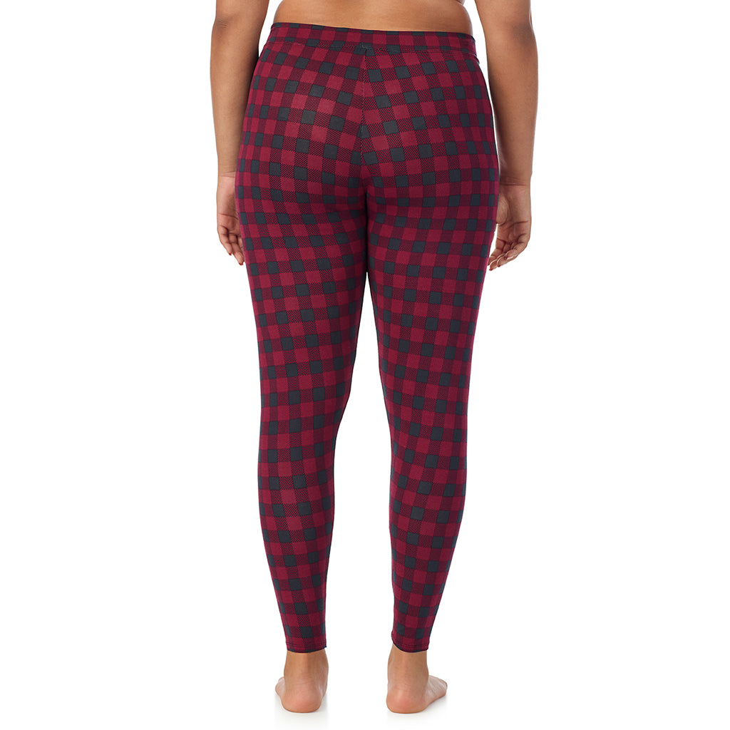 A lady wearing a cabernet buffalo check stretch legging plus.