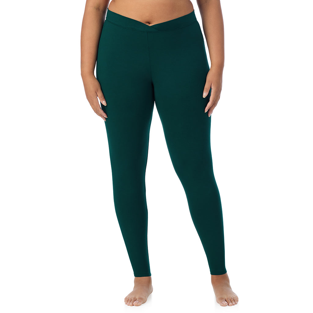 A lady wearing a dark pine stretch legging plus.