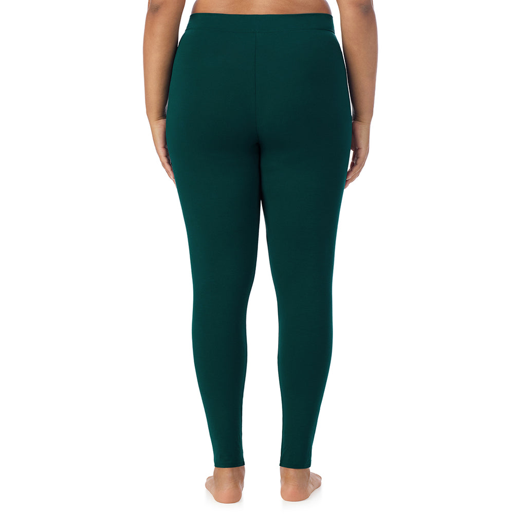 A lady wearing a dark pine stretch legging plus.