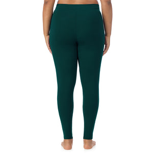 A lady wearing a dark pine stretch legging plus.