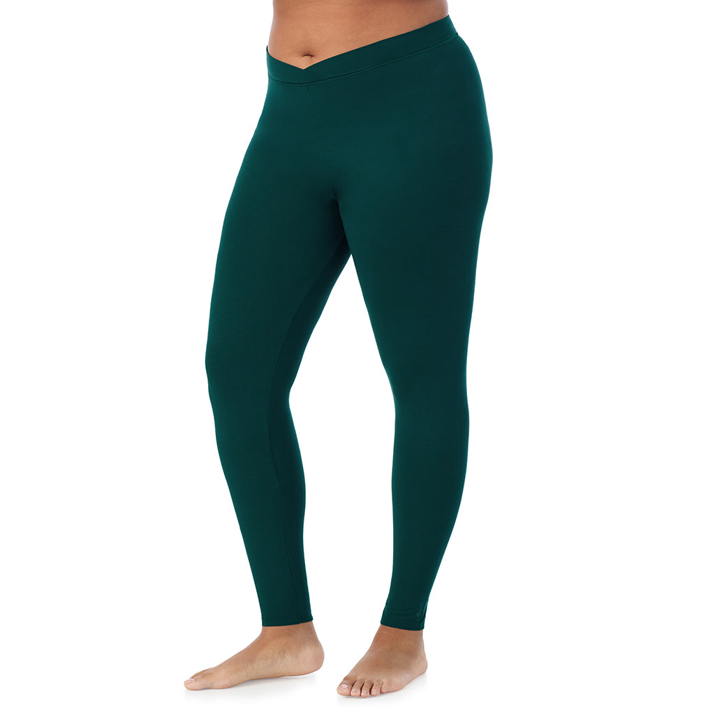 A lady wearing a dark pine stretch legging plus.