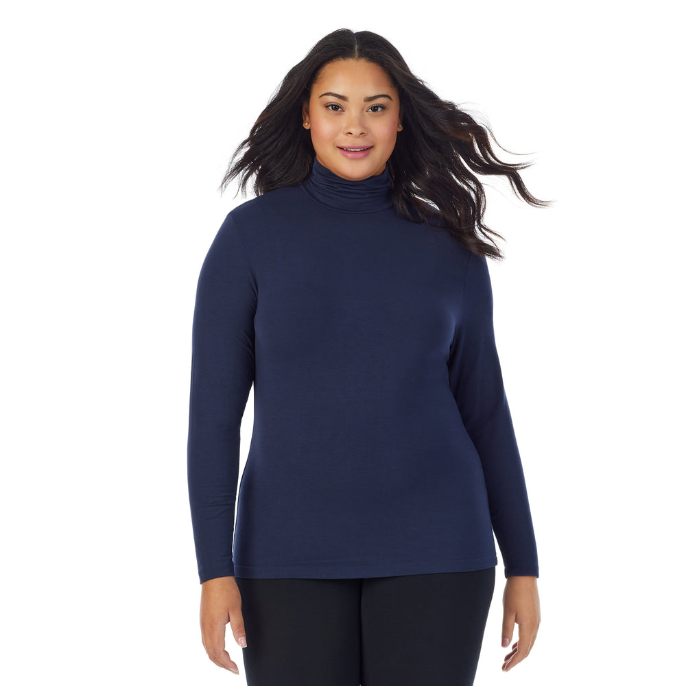 A lady wearing navy blazer long sleeve turtleneck plus softwear with stretch top.