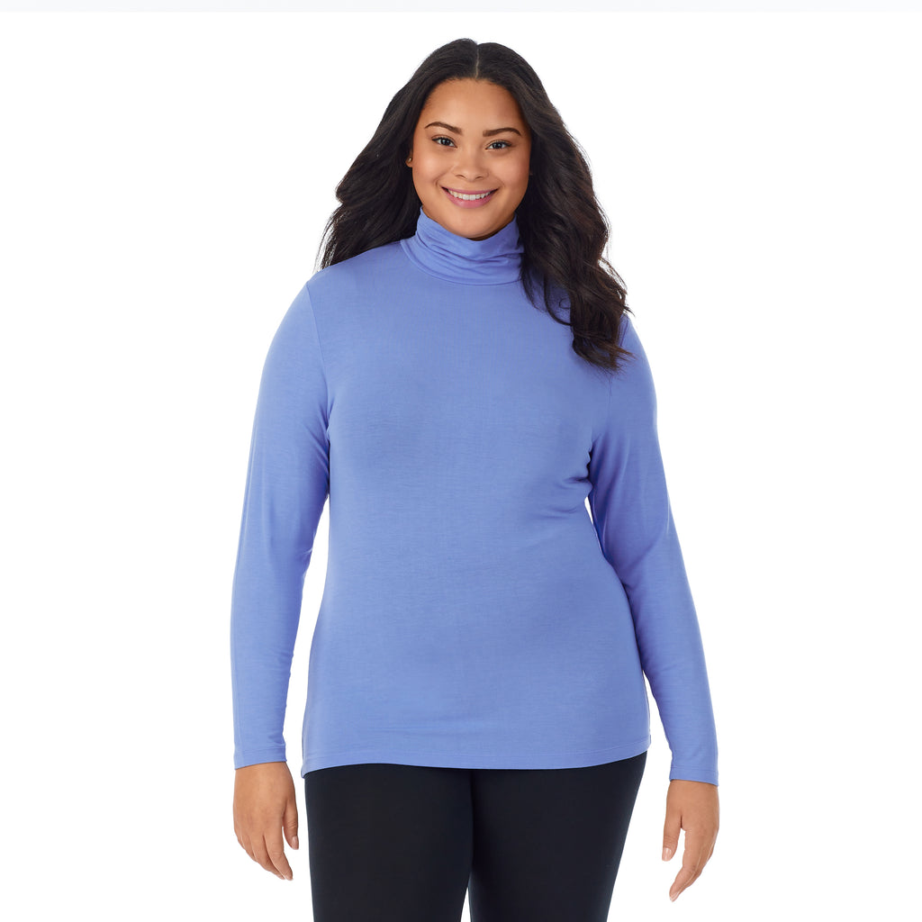 A lady wearing ultramarine long sleeve turtleneck plus softwear with stretch top.