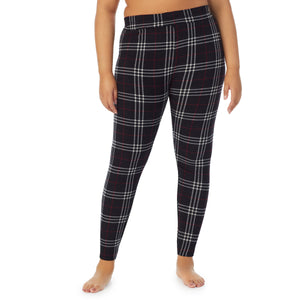 A lady wearing black plaid fleecewear with stretch legging plus. !59% Polyester, 35% Recycled Polyester, 6% Spandex !