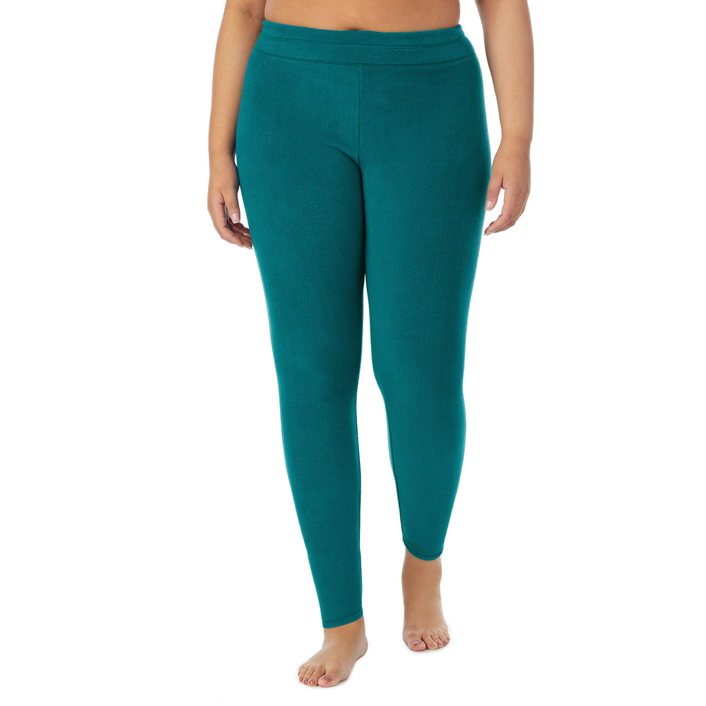 A lady wearing teal lagoon fleecewear with stretch legging plus. !59% Polyester, 35% Recycled Polyester, 6% Spandex !