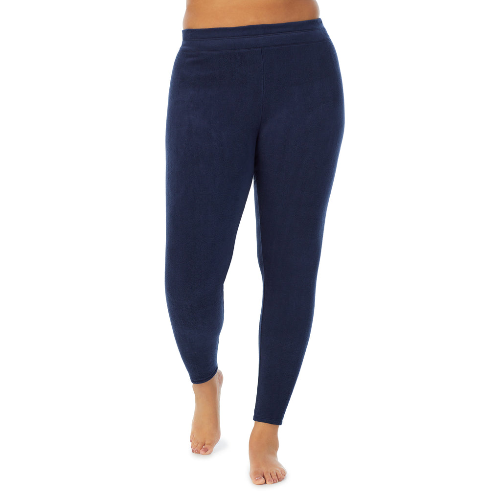 A lady wearing navy blazer fleecewear with stretch legging plus. !59% Polyester, 35% Recycled Polyester, 6% Spandex !