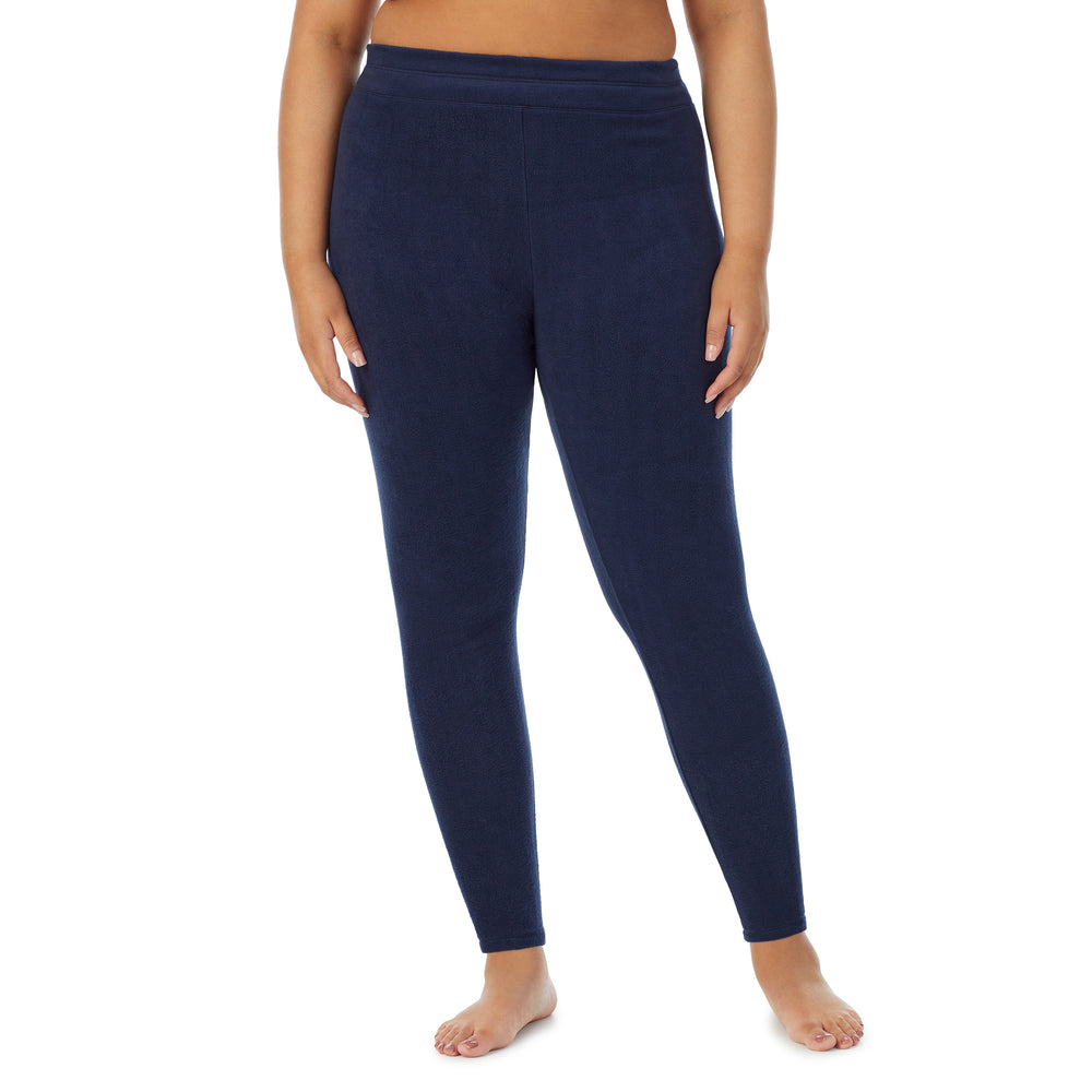 A lady wearing navy blazer fleecewear with stretch legging plus. !59% Polyester, 35% Recycled Polyester, 6% Spandex !