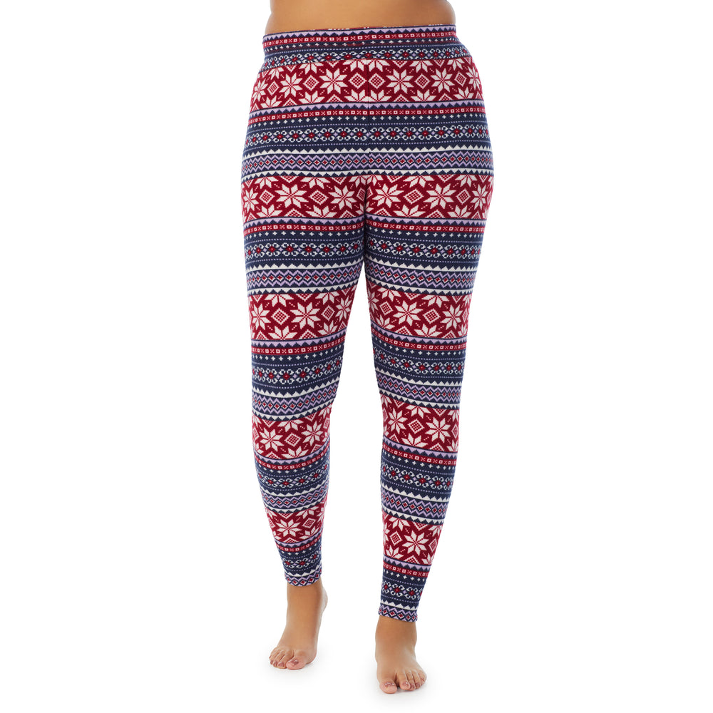 A lady wearing navy fairisle fleecewear with stretch legging plus. !59% Polyester, 35% Recycled Polyester, 6% Spandex !