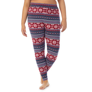 A lady wearing navy fairisle fleecewear with stretch legging plus. !59% Polyester, 35% Recycled Polyester, 6% Spandex !