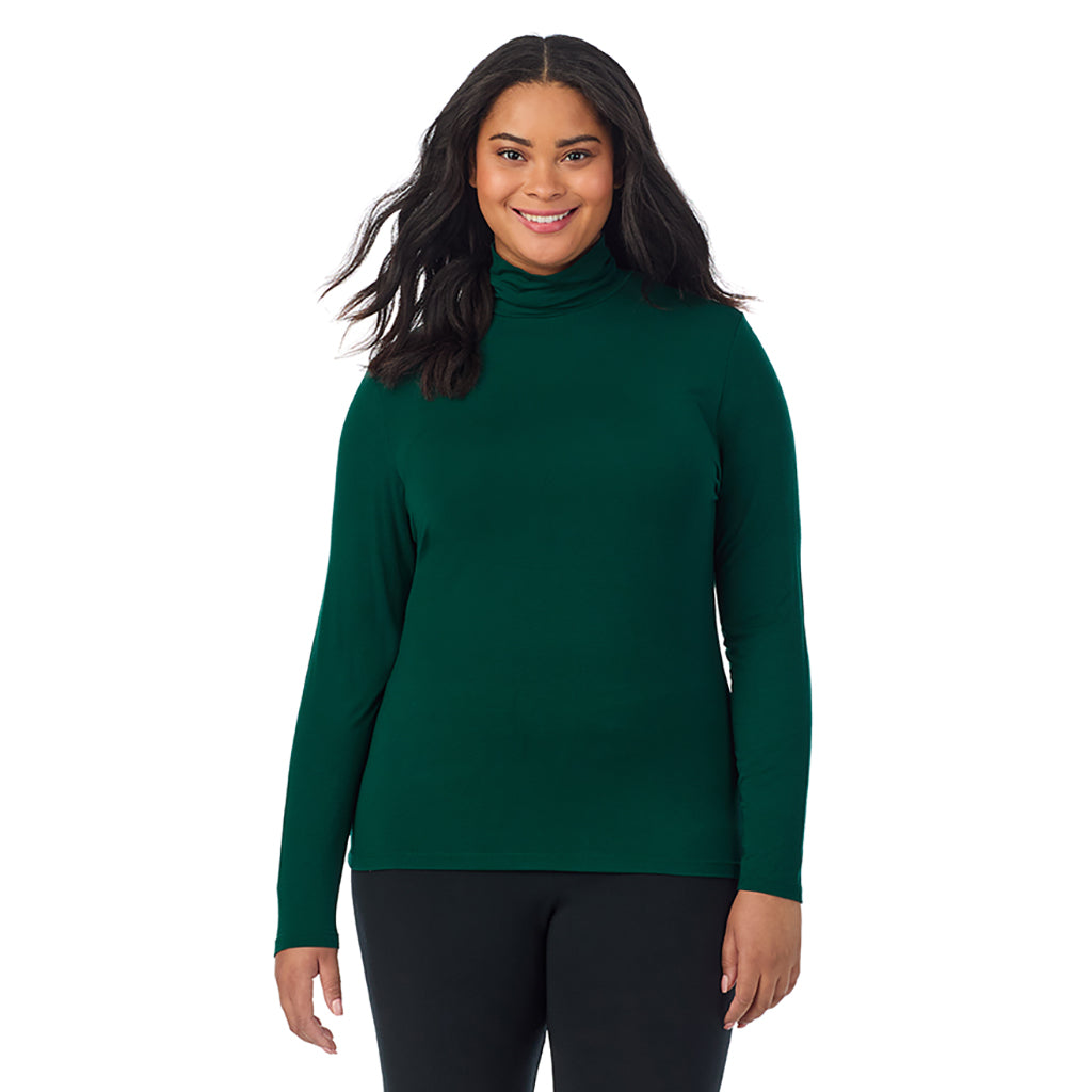 A lady wearing evergreen long sleeve turtleneck plus softwear with stretch top.