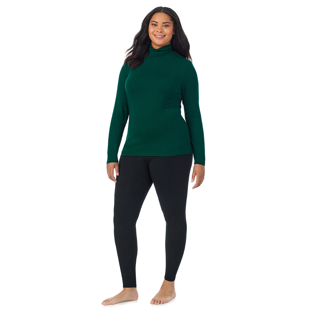 Evergreen; Model is wearing size 1X. She is 5'11", Bust 36", Waist 36.5", Hips 47.5". @A lady wearing evergreen long sleeve turtleneck plus softwear with stretch top.