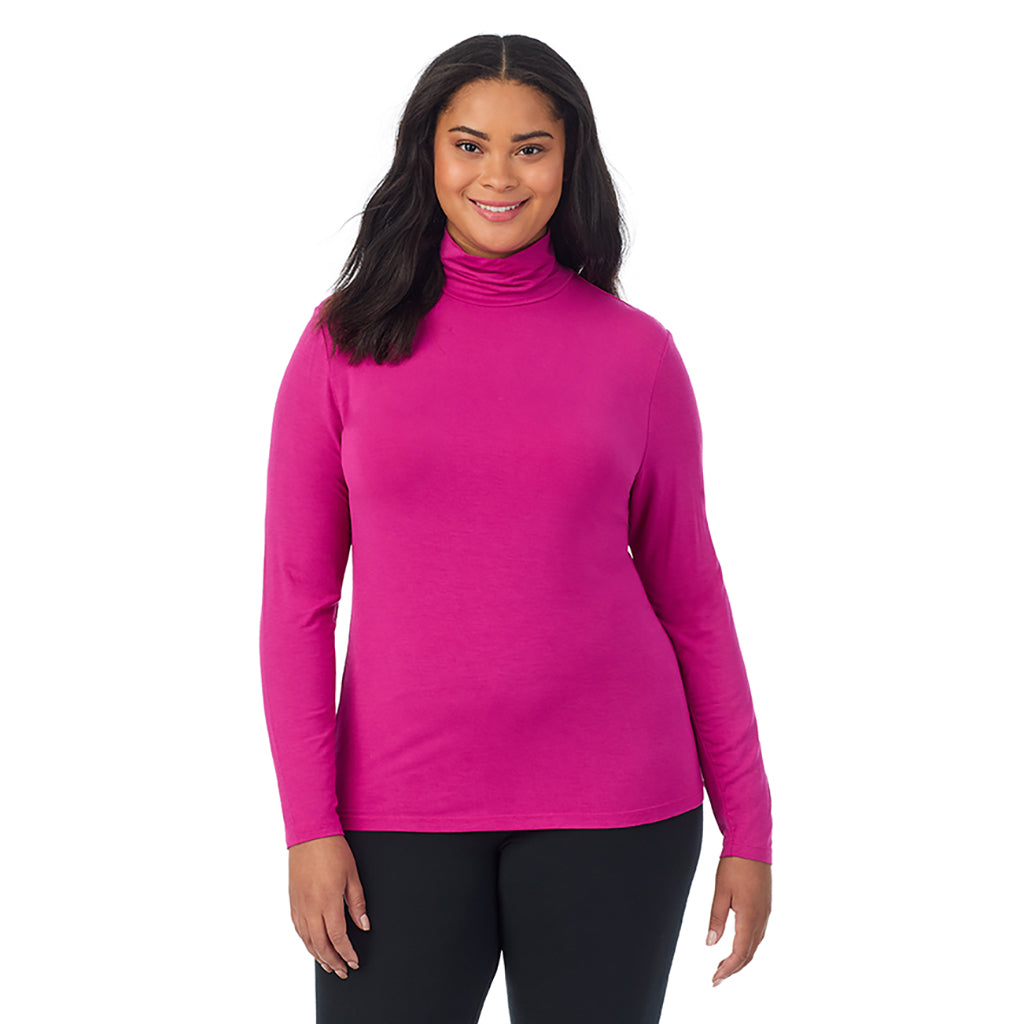 A lady wearing deep fuschia long sleeve turtleneck plus softwear with stretch top.