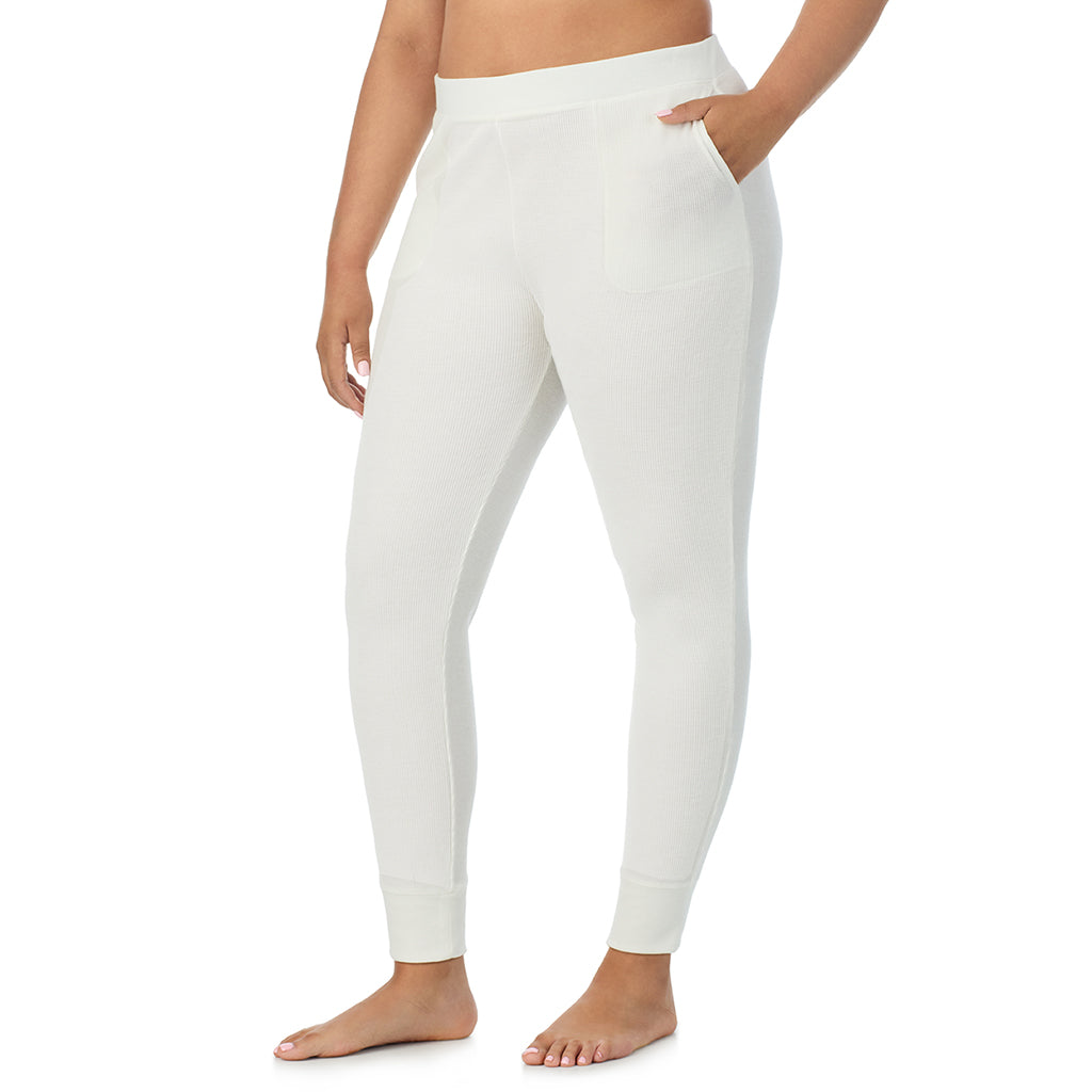  A Lady is wearing a Ivory Cozy Stretch Thermal Legging PLUS