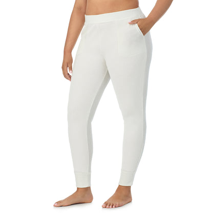 Ivory; Model is wearing size 1X. She is 5'11", Bust 36", Waist 36.5", Hips 47.5"@ A Lady is wearing a Ivory Cozy Stretch Thermal Legging PLUS