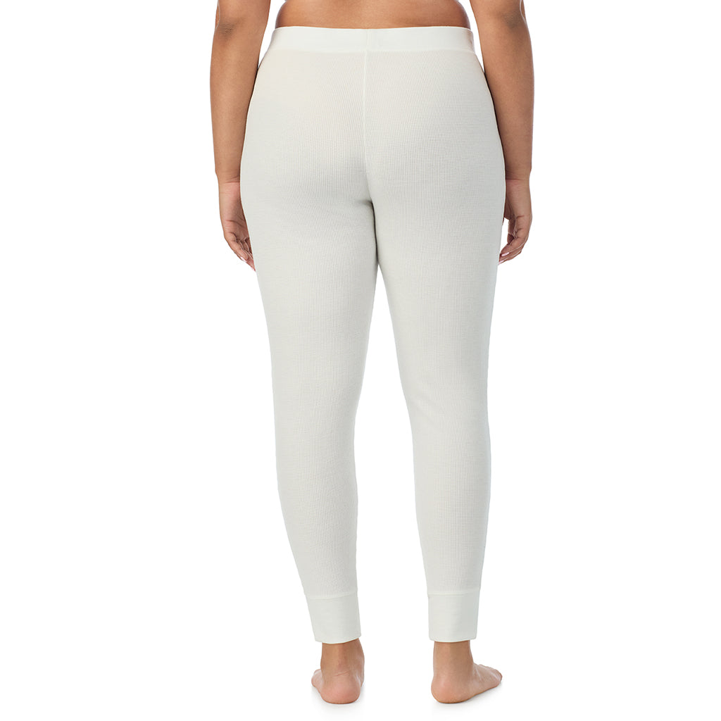  A Lady is wearing a Ivory Cozy Stretch Thermal Legging PLUS