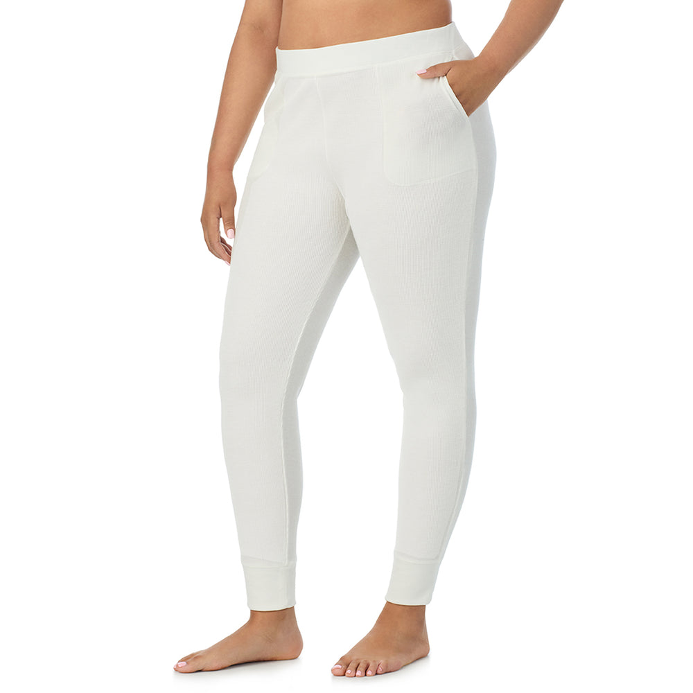 A Lady is wearing a Ivory Cozy Stretch Thermal Legging PLUS