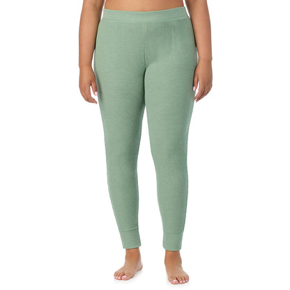 Soft Olive Heather; Model is wearing size 1X. She is 5'11", Bust 36", Waist 36.5", Hips 47.5"@ A Lady is wearing a Soft Olive Heather Cozy Stretch Thermal Legging PLUS